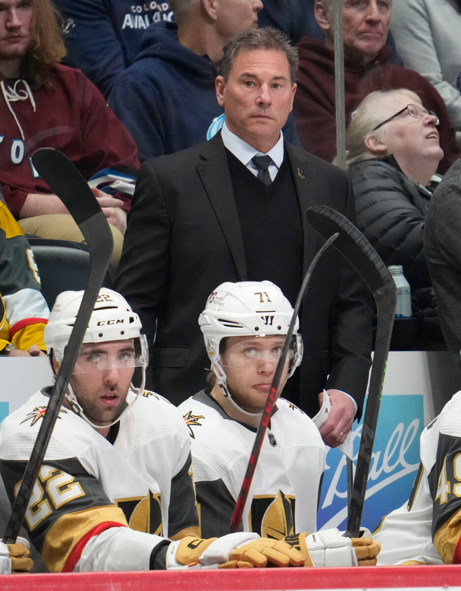 Vegas Golden Knights head coach Bruce Cassidy, top center, looks on from the team box in the se ...
