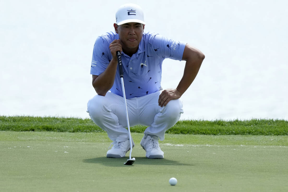 Justin Suh lines up a putt on the 18th green during the second round of the Honda Classic golf ...