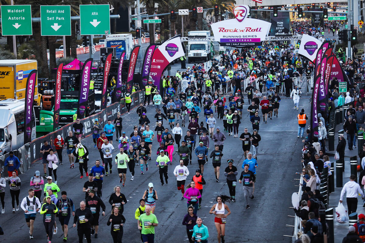 Runners race in the Rock ’n’ Roll Running Series Racing Event on the Strip in Las ...
