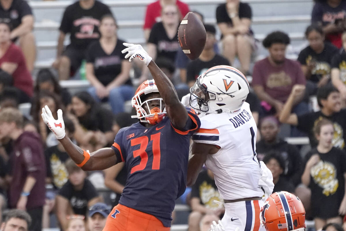 Illinois defensive back Devon Witherspoon breaks up a pass in the end zone intended for Virgini ...
