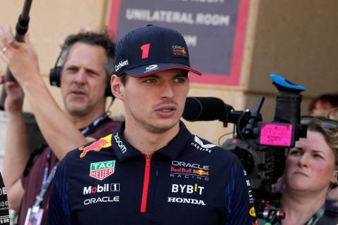 Red Bull driver Max Verstappen of the Netherlands arrives at the paddock during a Formula One p ...