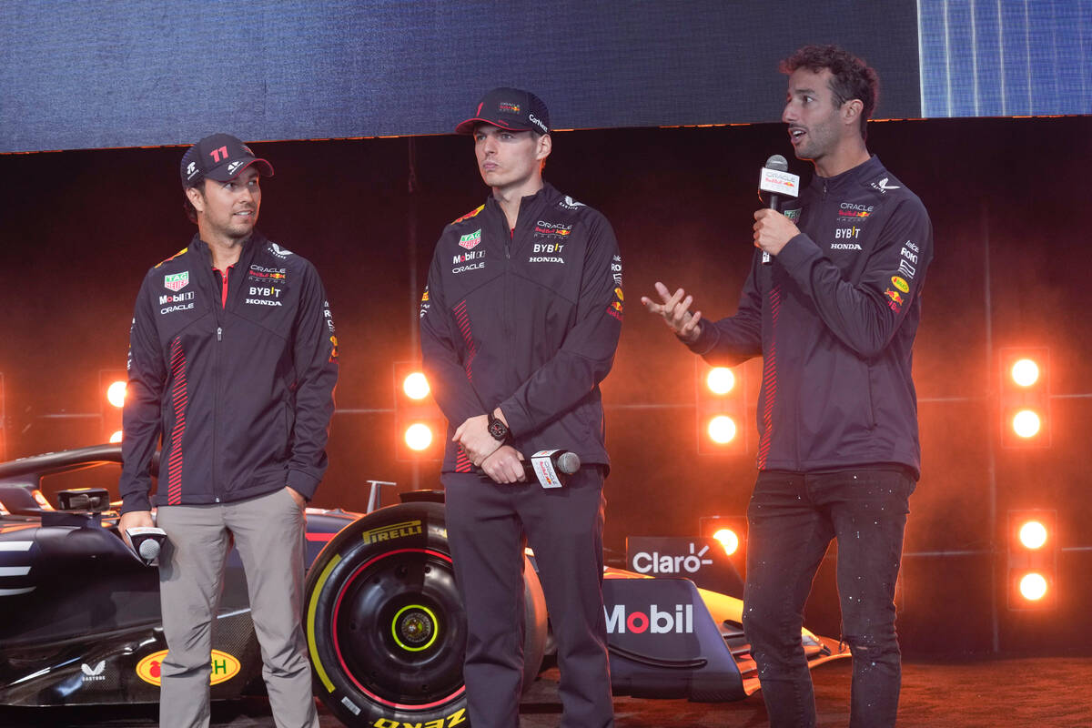 Oracle Red Bull Racing drivers Sergio Perez, left, Max Verstappen, center, and Daniel Ricciardo ...