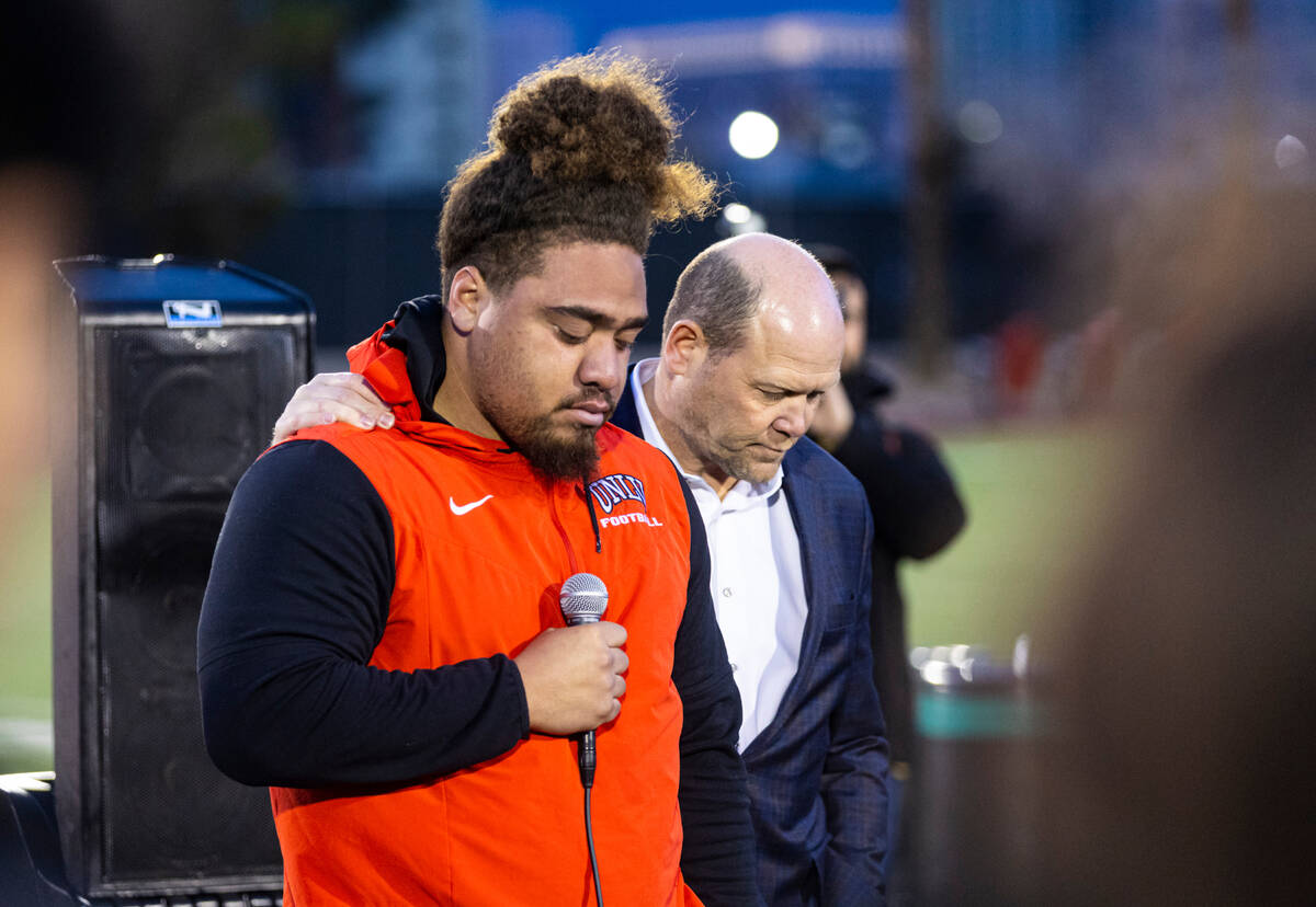 UNLV defensive lineman Naki Fahina speaks with the support of football head coach Barry Odom du ...