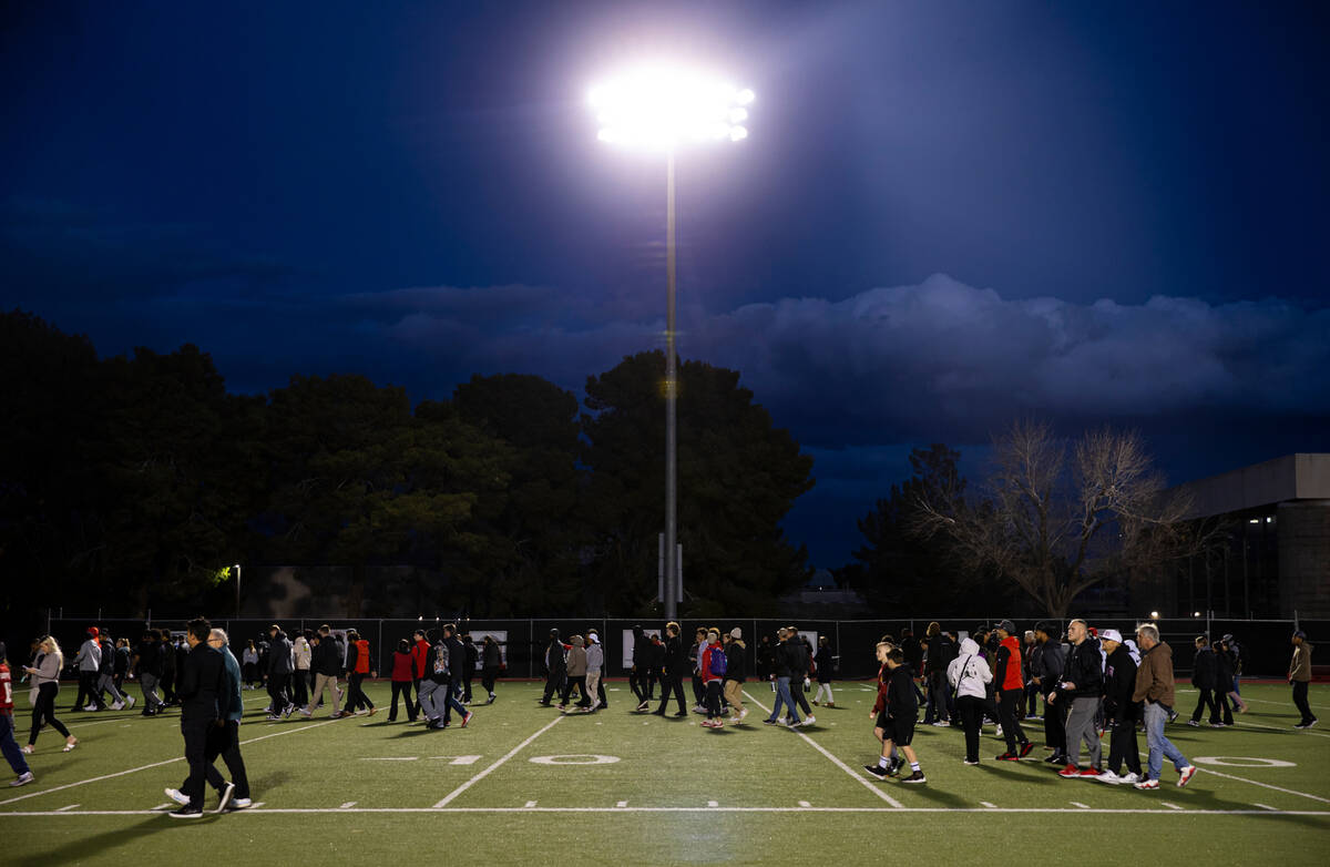 People make their way off the field at Rebel Park at the Fertitta Football Complex after a vigi ...