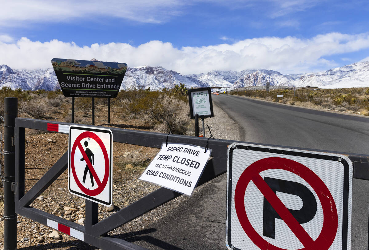 A sign is posted at the entrance of the Scenic Drive notifying visitors that the Scenic Drive ...