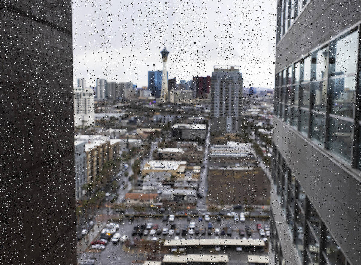The Stratosphere is seen through a glass window with rain drops during a rainy morning, on Wedn ...