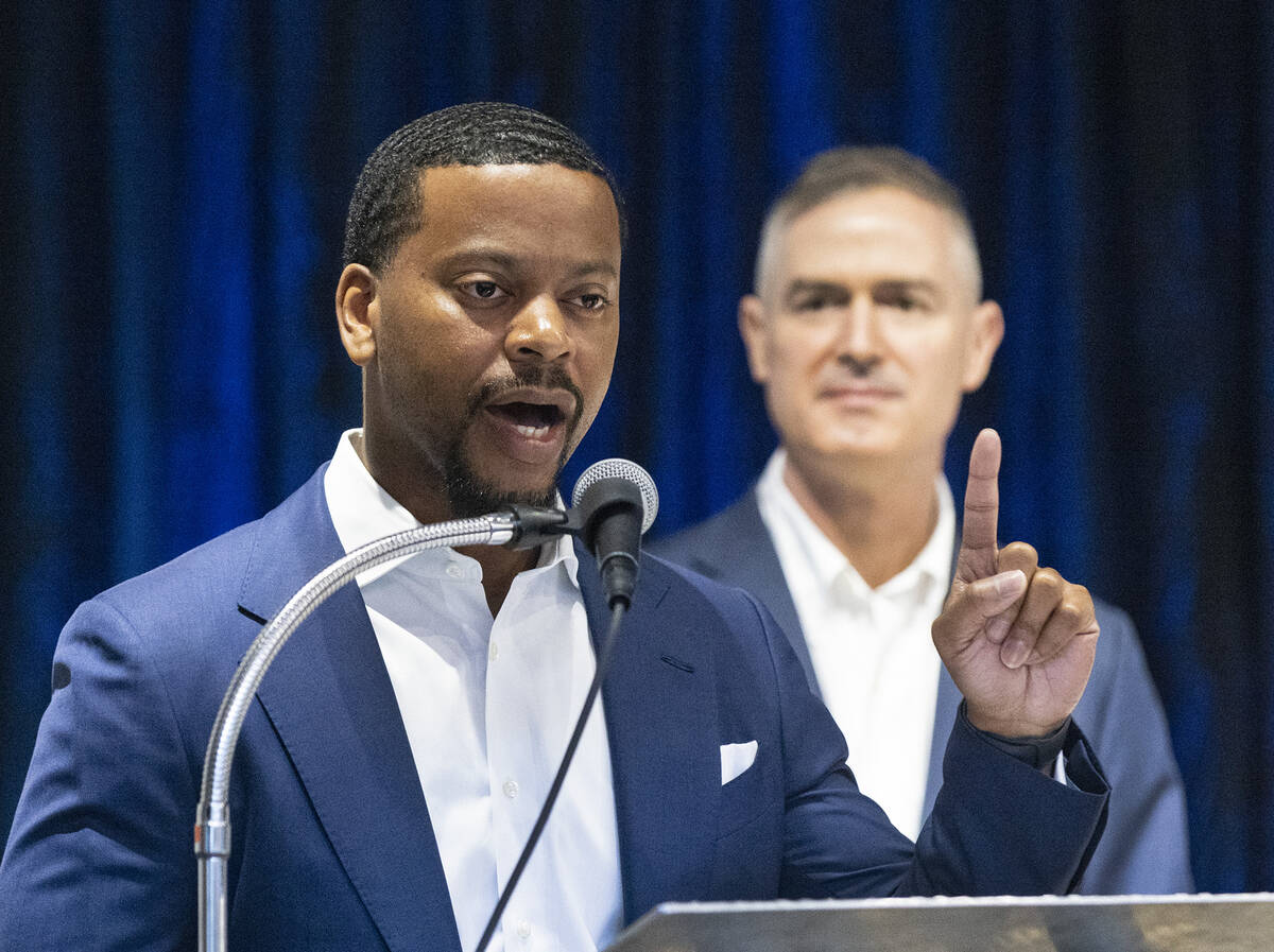 Clark County Commissioner William McCurdy II speaks as Tom Kovach, right, executive director, L ...