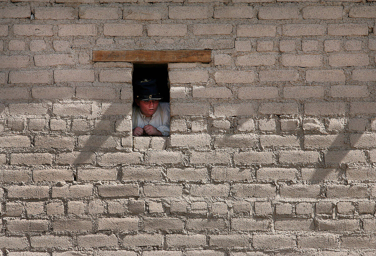 Niall St. John, 15, looks out one of the windows of the Old Mormon Fort at the Culture History ...