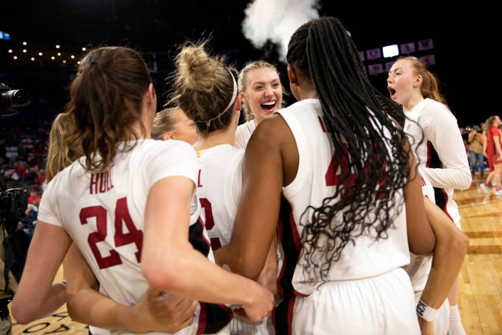Stanford players including forward Cameron Brink, center right, celebrate after winning an NCAA ...