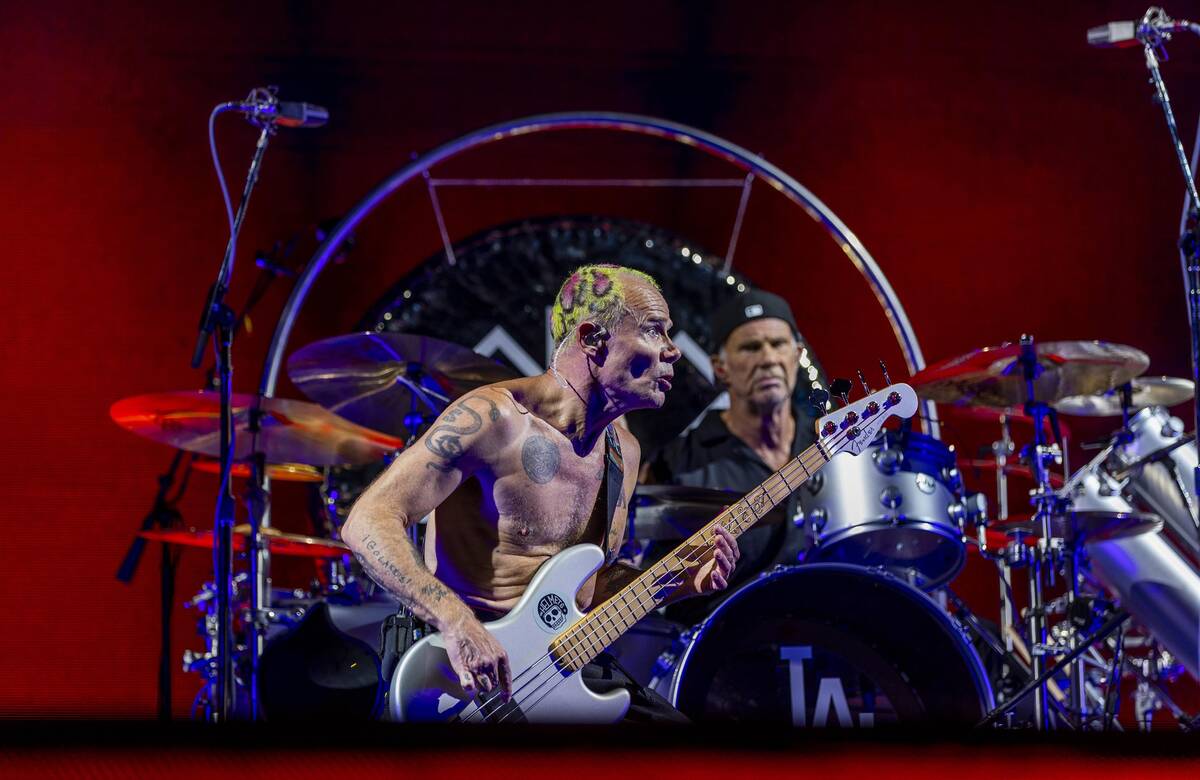 Bassist Flea and drummer Chad Smith perform with The Red Hot Chili Peppers at Allegiant Stadium ...