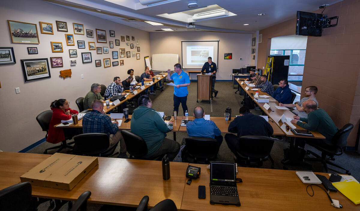 Metropolitan Police Department officer Mike Thiele reviews quiz answers during a course on Adva ...