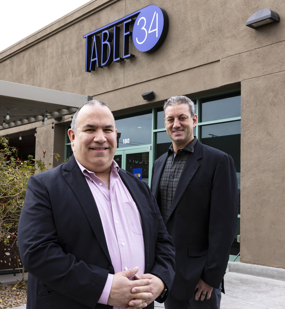 Table 34 owners Constantin Alexander, left, and Evan Glusman pose for a photo outside their Las ...