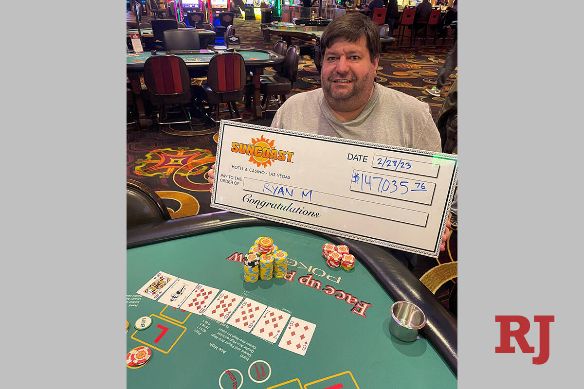 Arizona resident Ryan shows off his promotional check after winning $147,035.76 on Pai Gow Poke ...
