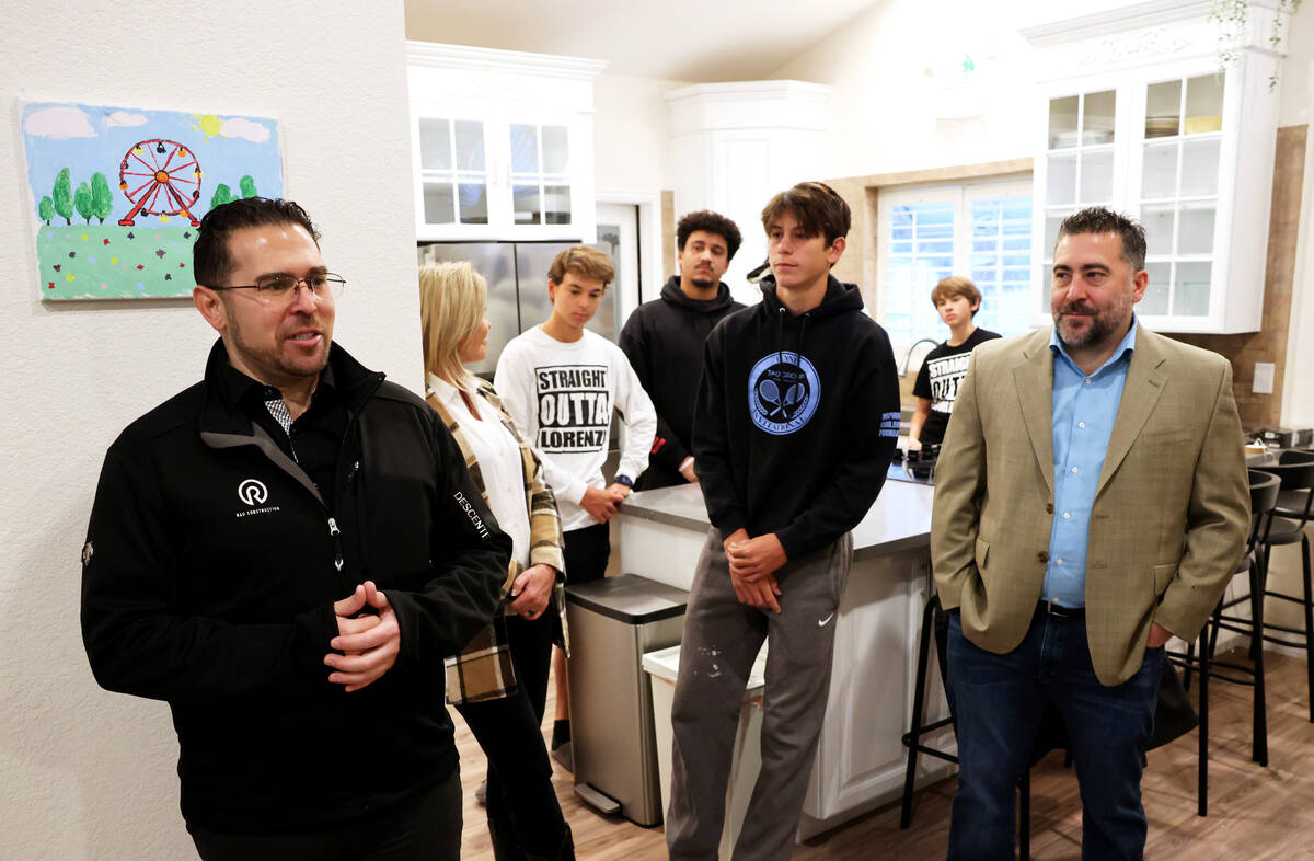 Philip DiGiacomo, marketing manager for R&O Construction, left, speaks during a news conference ...