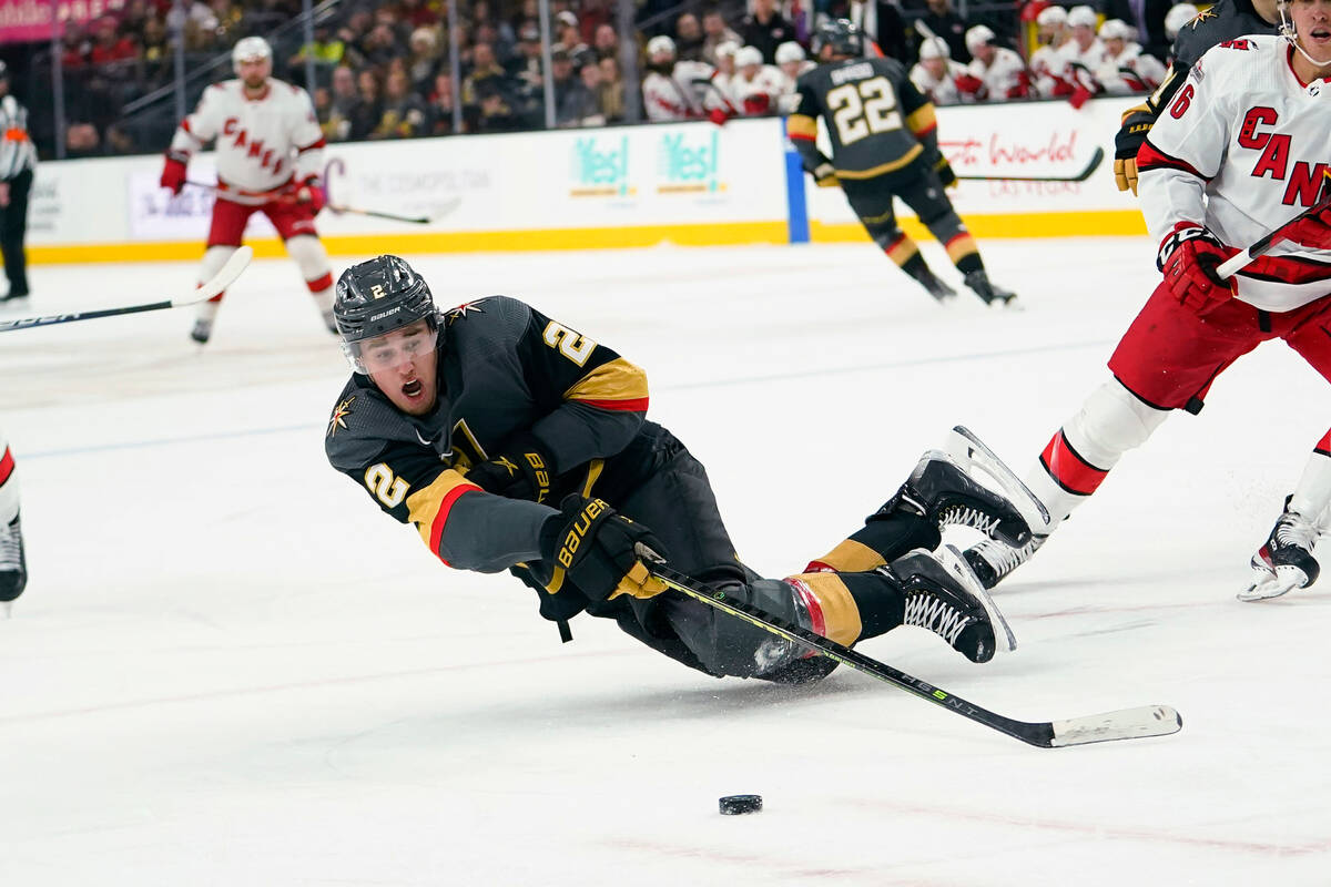 Vegas Golden Knights defenseman Zach Whitecloud (2) reaches for the puck during the first perio ...