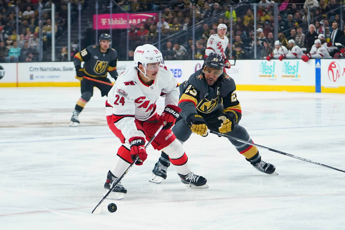 Carolina Hurricanes center Seth Jarvis (24) skates with the puck against Vegas Golden Knights d ...