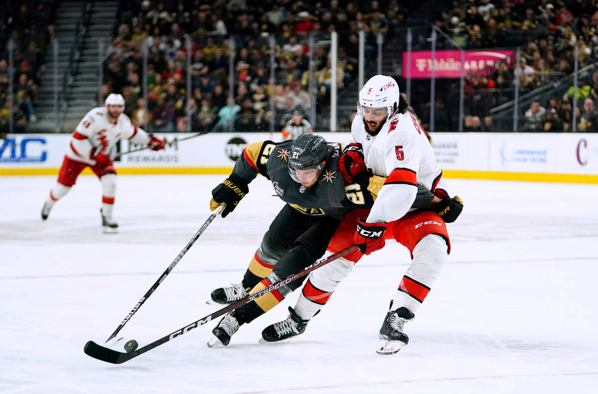 Vegas Golden Knights center Brett Howden (21) skates for the puck against Carolina Hurricanes d ...