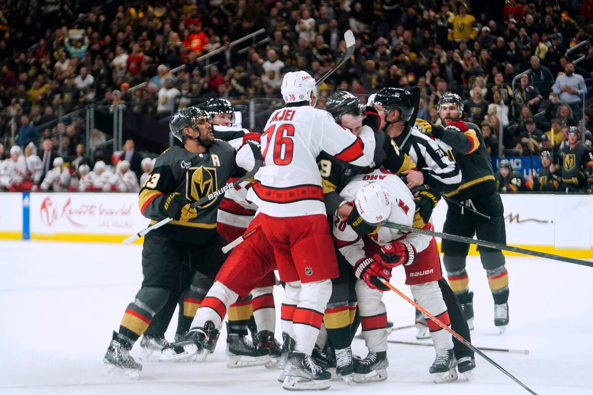 Vegas Golden Knights and Carolina Hurricanes fight during the second period of an NHL hockey ga ...