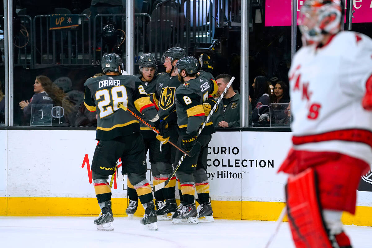 Vegas Golden Knights celebrate a goal against Carolina Hurricanes goaltender Frederik Andersen ...