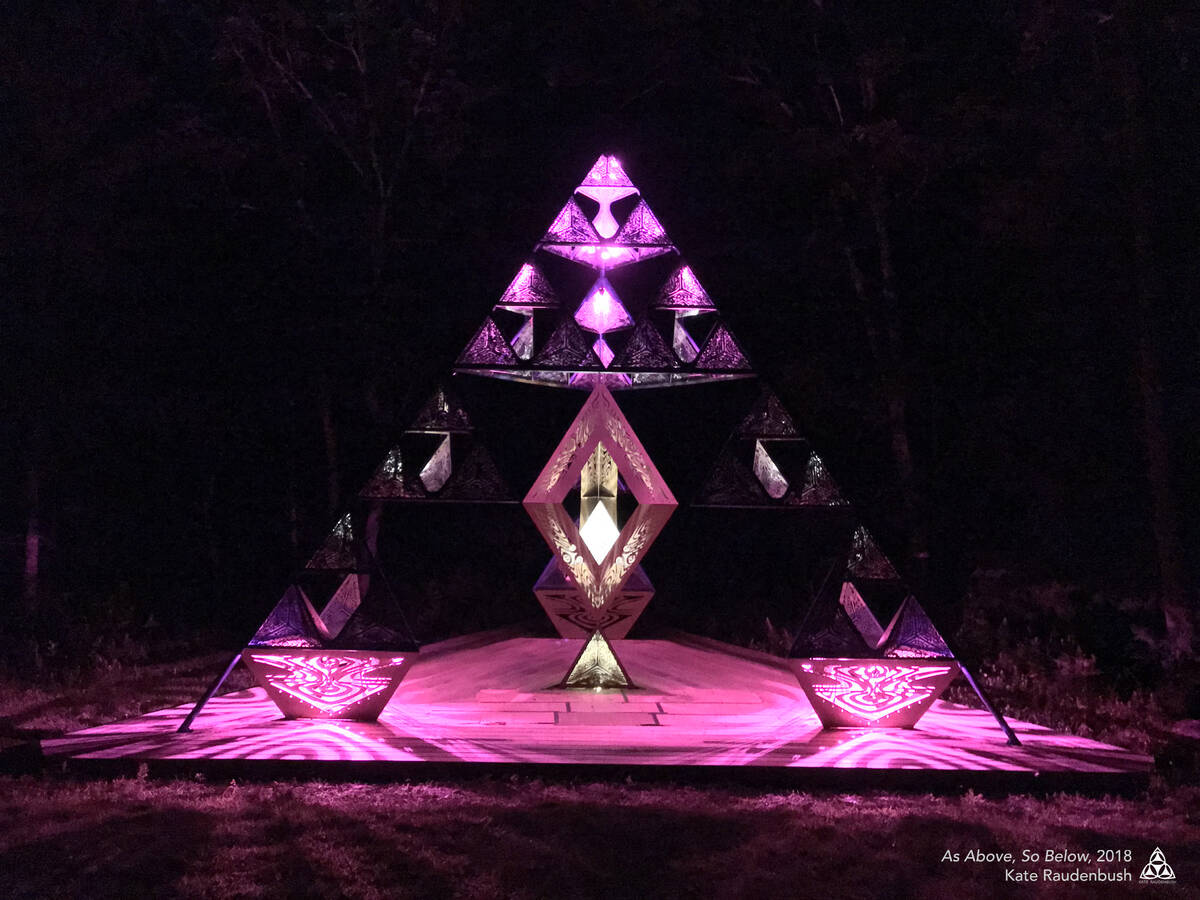 Kate Raudenbush’s “As Above, So Below,” a 25-foot-tall pyramid and stage made of laser cu ...