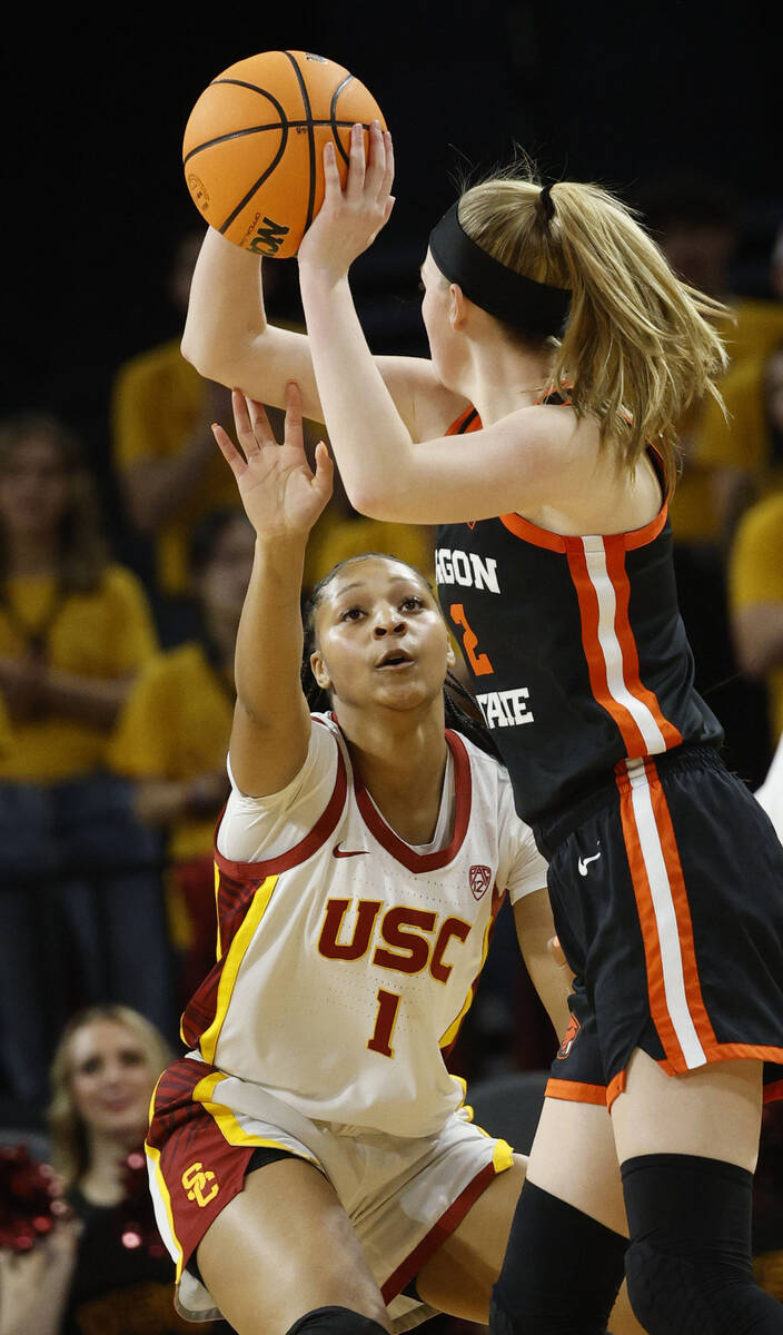 Oregon State Beavers guard Lily Hansford (2) looks to pass against USC Trojans guard Taylor Big ...