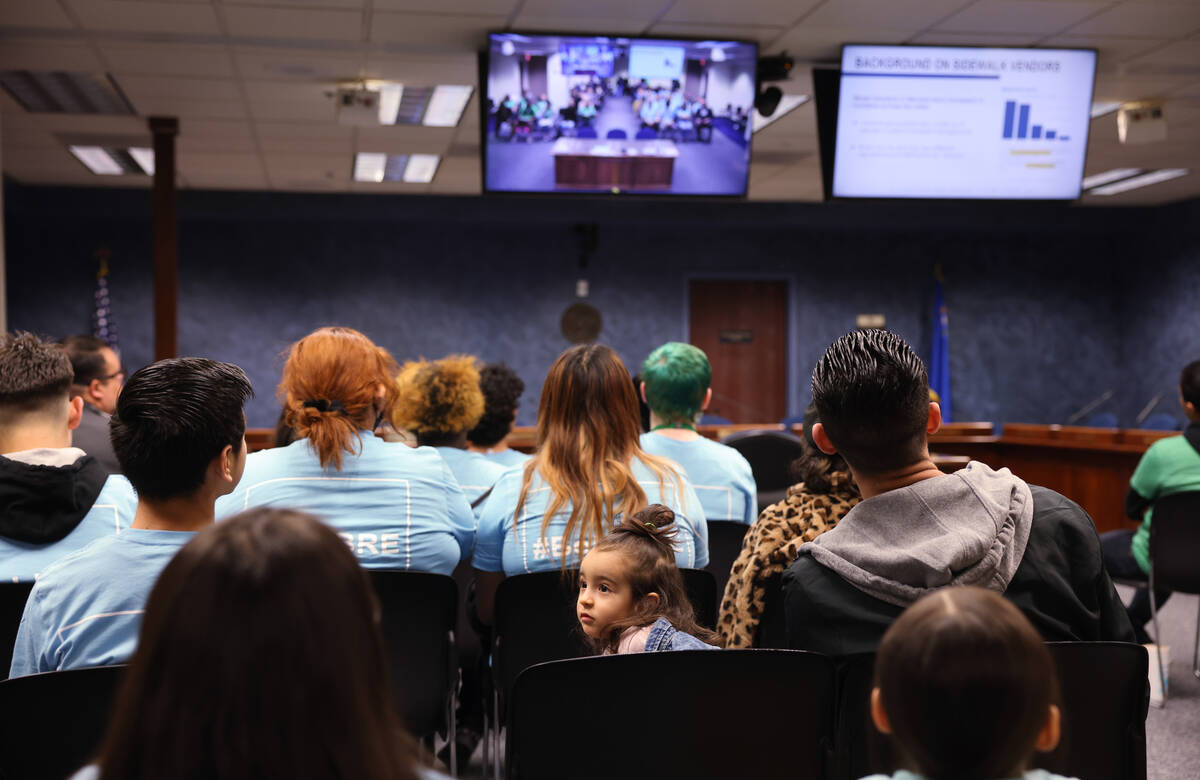 People at the Sawyer Building in Las Vegas watch a meeting addressing SB92 via videoconference ...