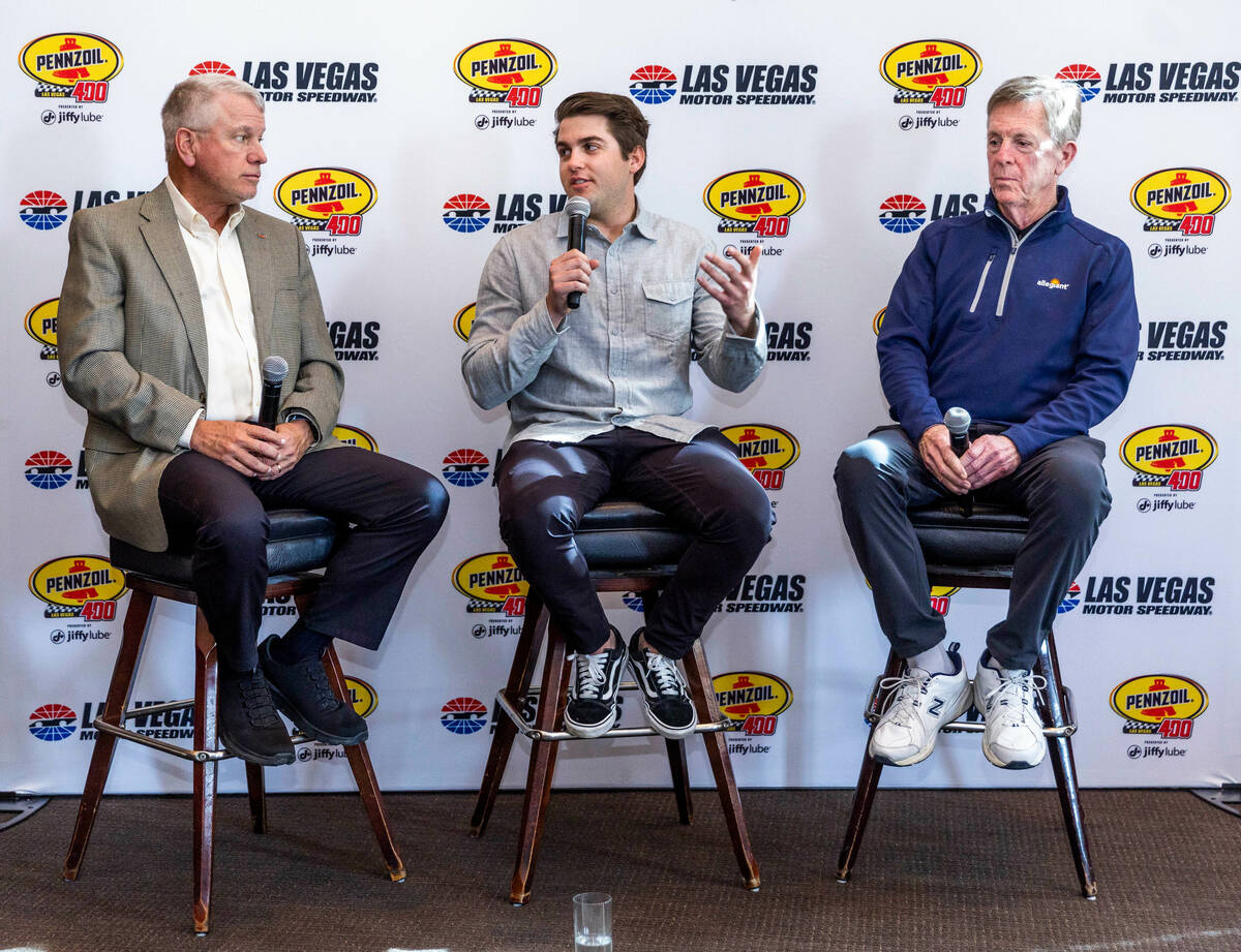 (LtoR) Chris Powell, president and general manager of the Las Vegas Motor Speedway listens to N ...