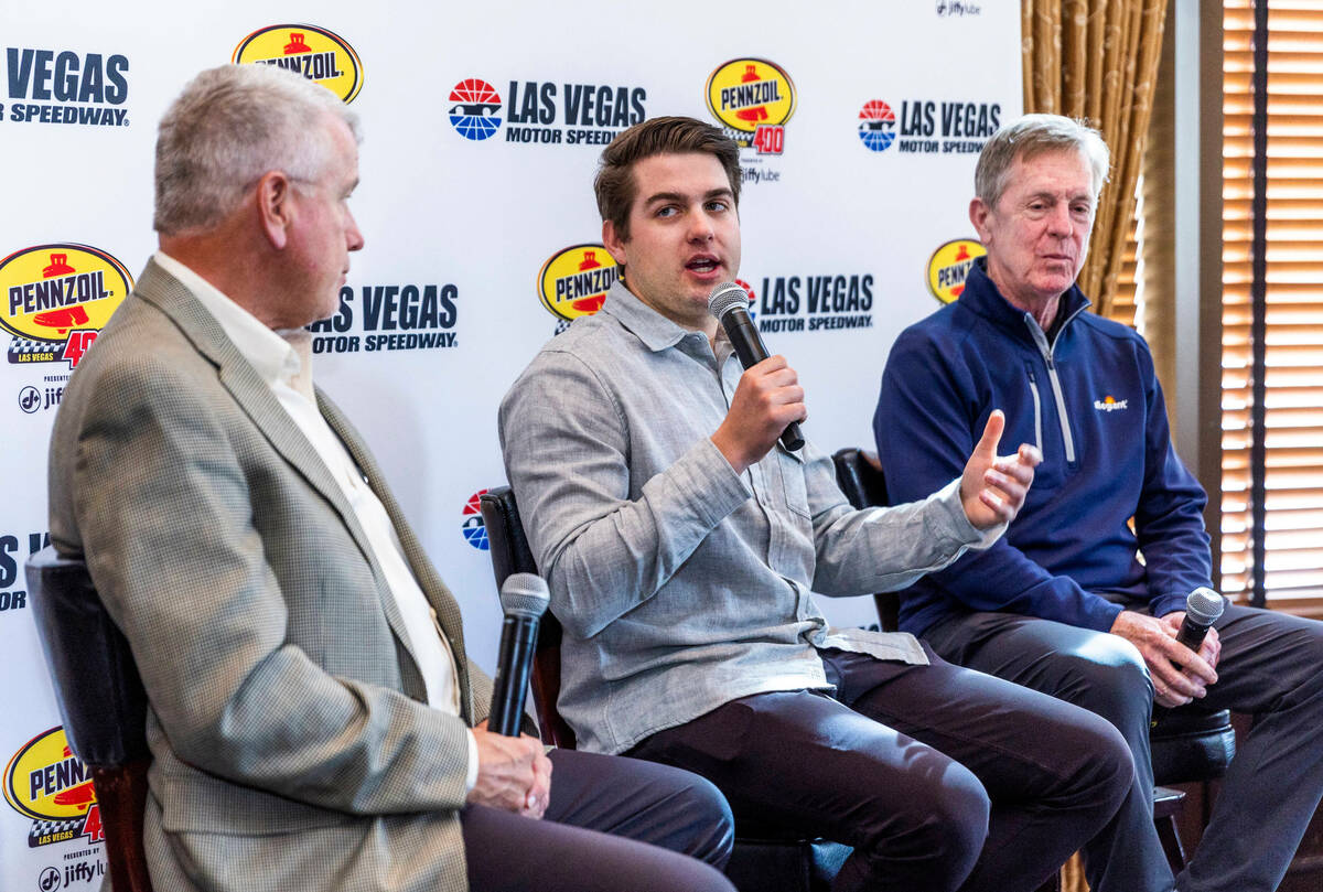 (LtoR) Chris Powell, president and general manager of the Las Vegas Motor Speedway listens to N ...