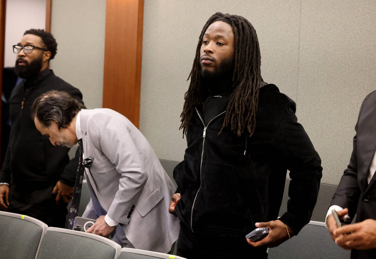 New Orleans Saints running back Alvin Kamara stands for the judge in court before an arraignmen ...