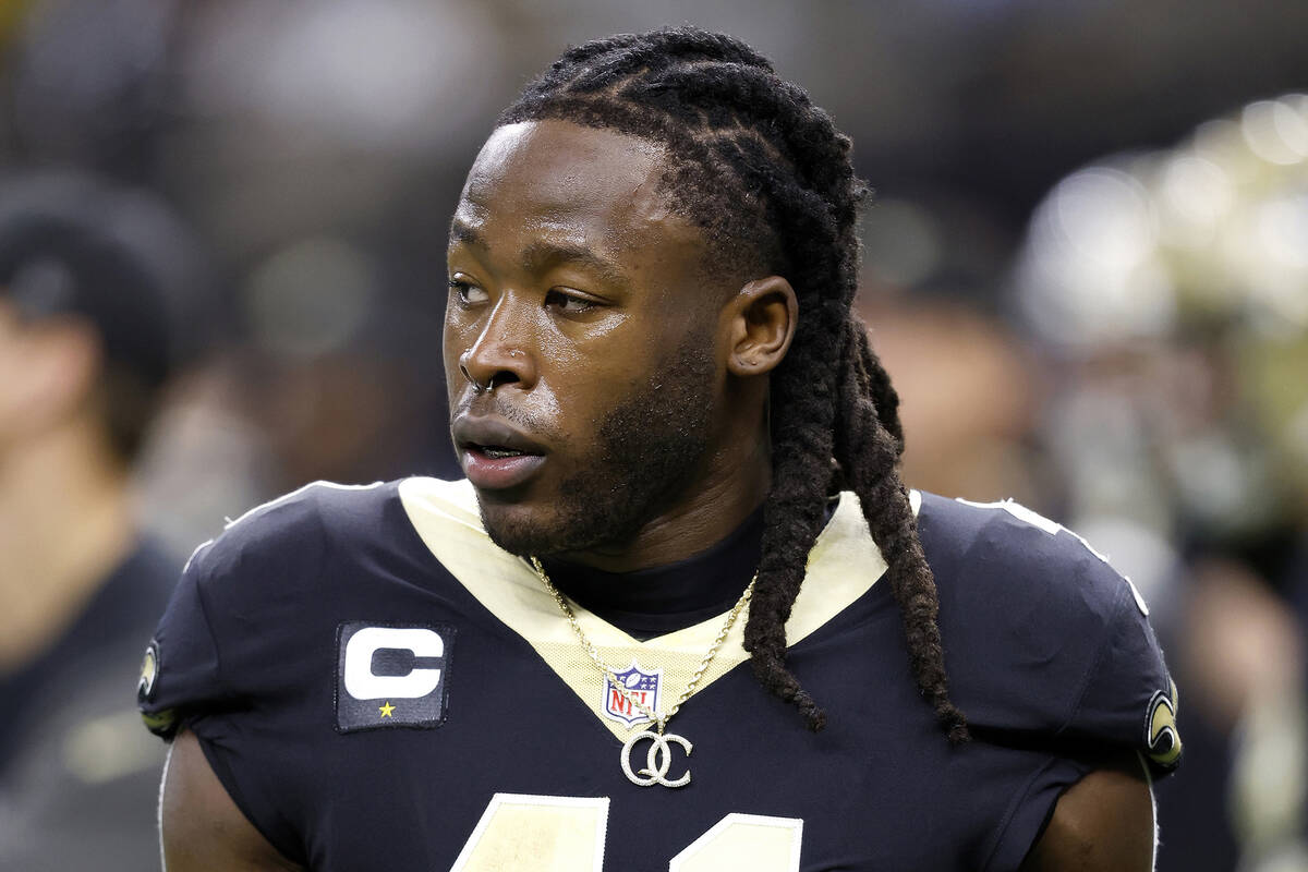 FILE - New Orleans Saints running back Alvin Kamara warms up for the team's NFL football game a ...