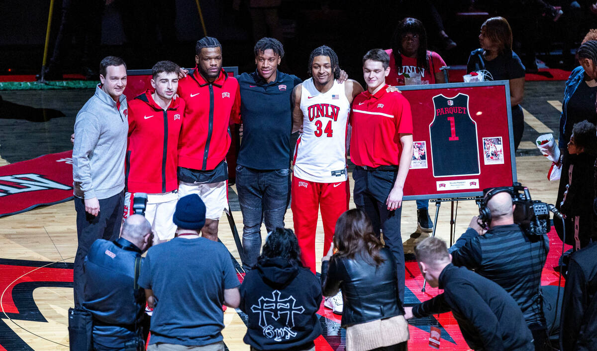 UNLV seniors are honored with head coach Kevin Kruger before facing Utah State during the first ...