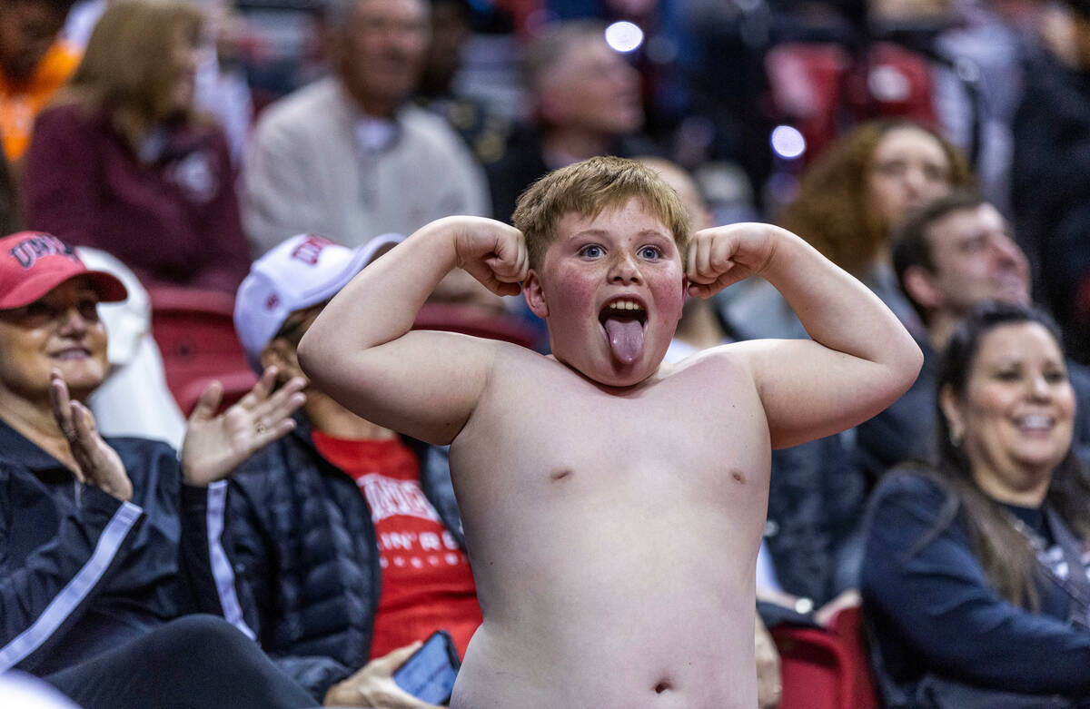 A young UNLV fan shows off while on the "flex cam" in a timeout against Utah State du ...