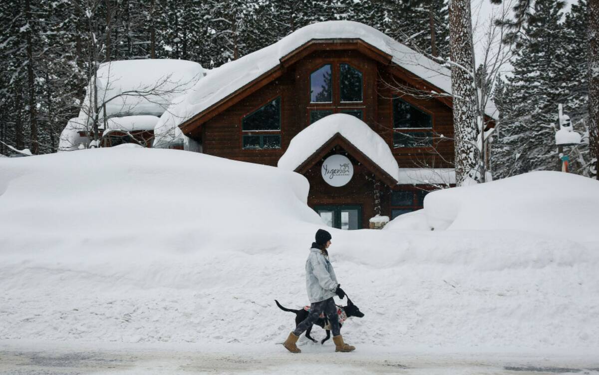 Laurene Bishop, from South Lake Tahoe, walks her dog Aubrey down Ski Run Boulevard in South Lak ...