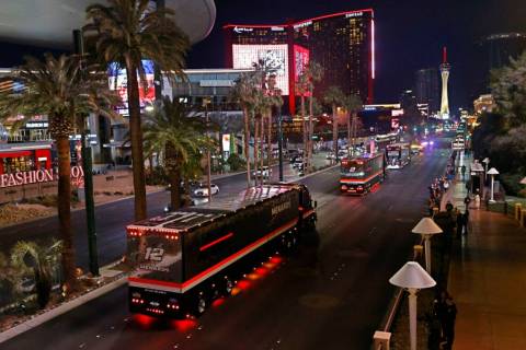 NASCAR Cup Series haulers including the hauler of Ryan Blaney (12) parade down the Las Vegas St ...