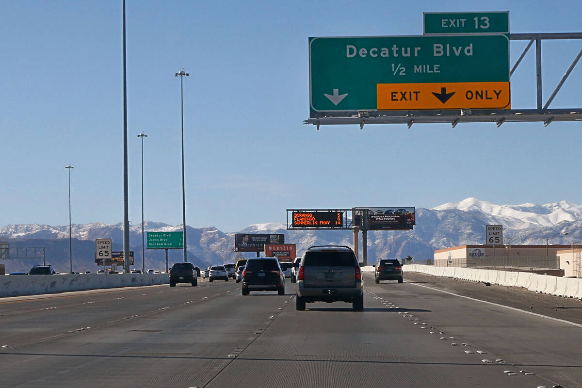 An exit sign to Decatur Boulevard is seen on the 215 Beltway, Thursday, March 2, 2023, in Las V ...