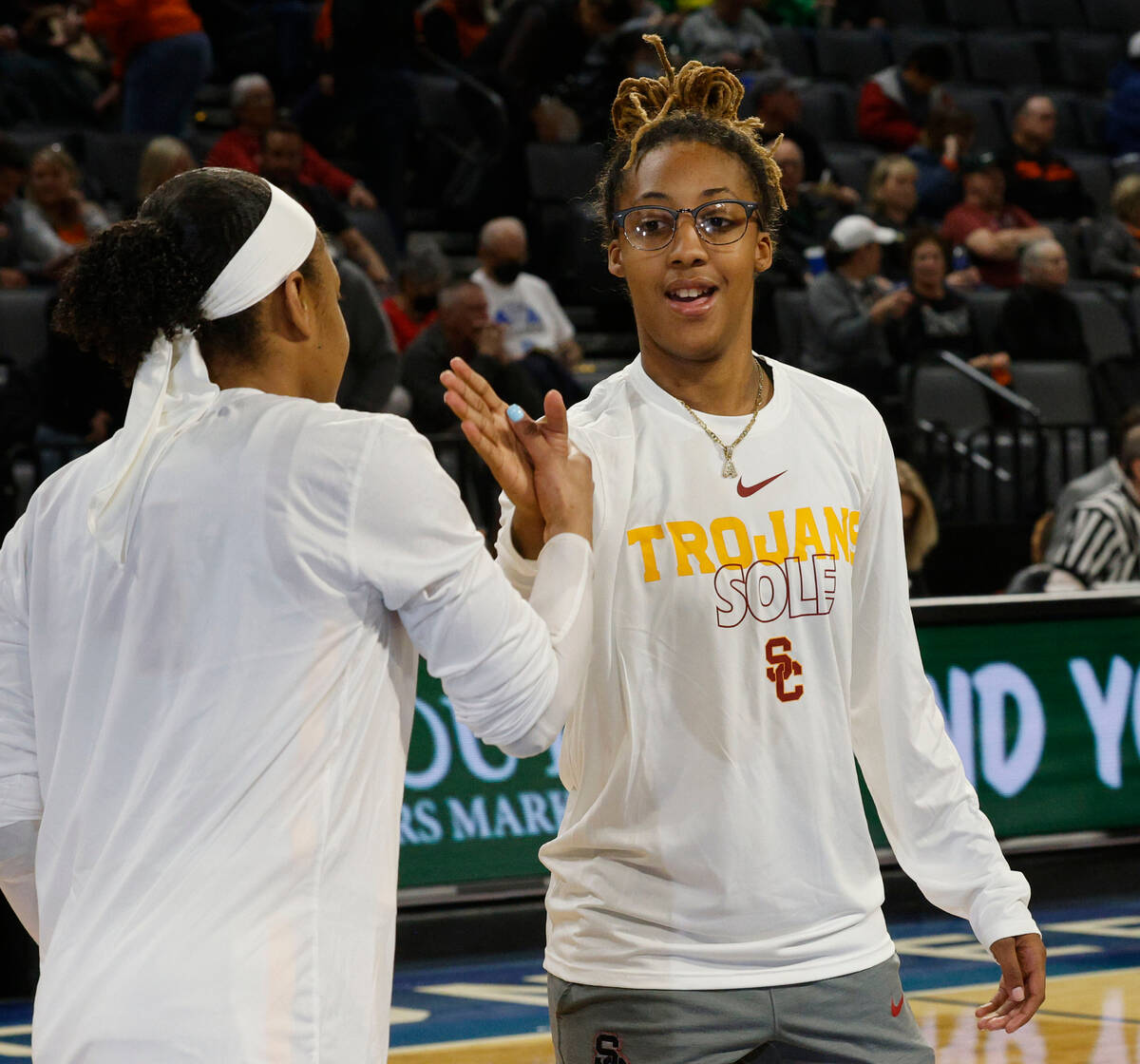 USC Trojans guard Aaliyah Gayles (3), right, and  her teammate high-five before an NCAA co ...