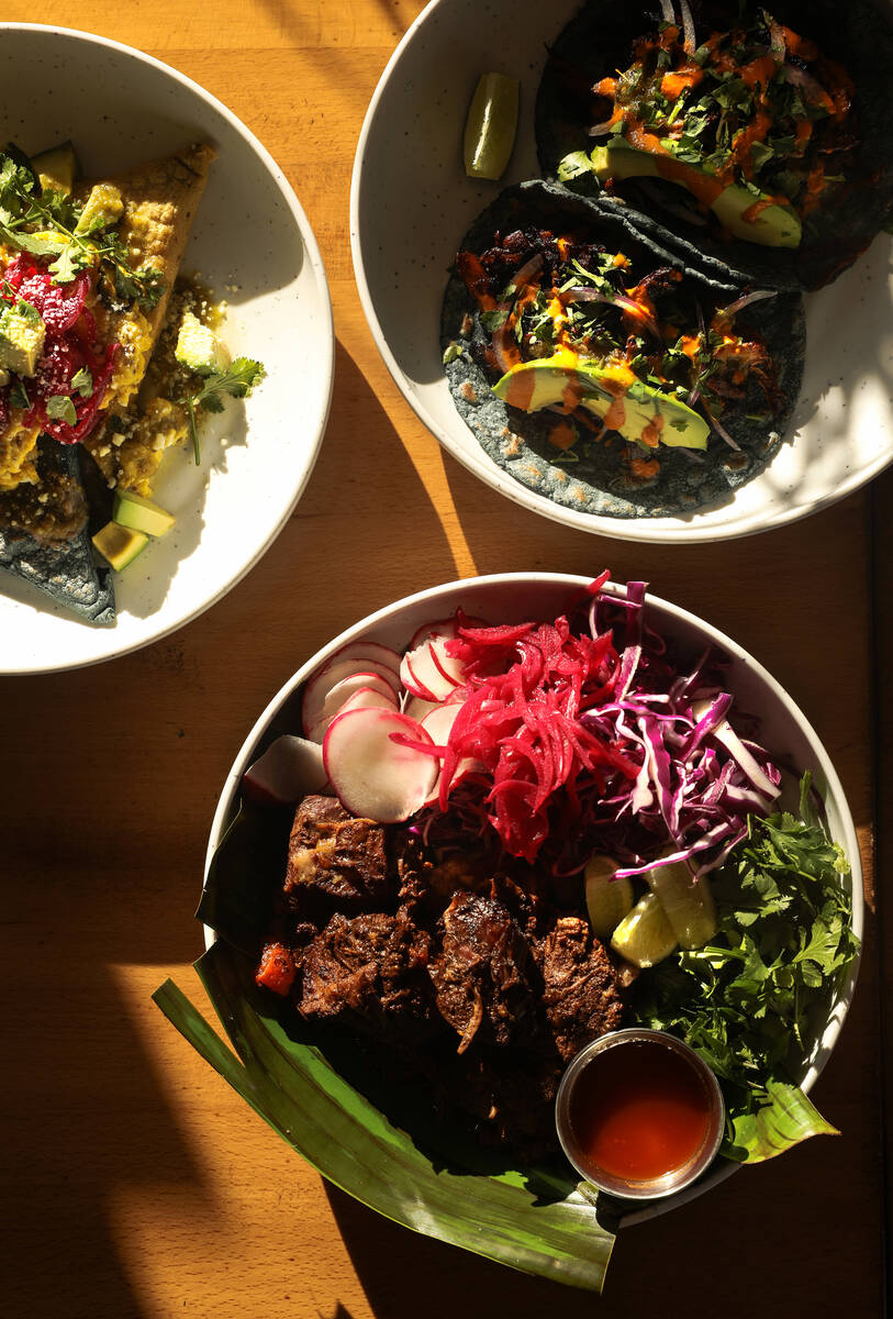 Black bean tetela, clockwise from left, mushroom tacos, and barbacoa from Milpa, a Mexican rest ...