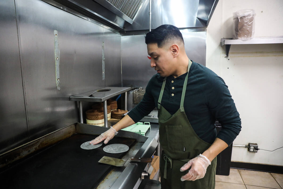 Chef DJ Flores uses freshly made masa to create corn tortillas at Milpa, his Mexican restaurant ...