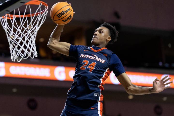 Pepperdine forward Maxwell Lewis (24), who is from Las Vegas, dunks during warmups before a Wes ...
