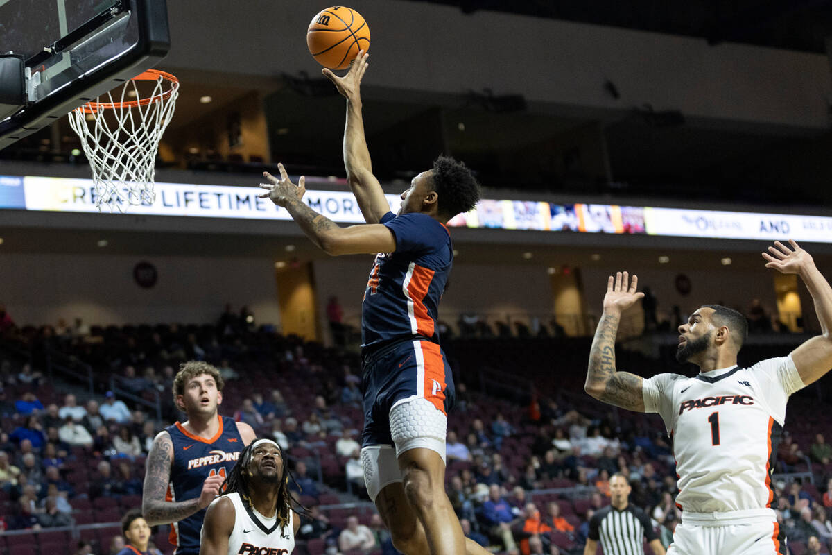 Pepperdine forward Maxwell Lewis (24), who is from Las Vegas, shoots against Pacific during a W ...