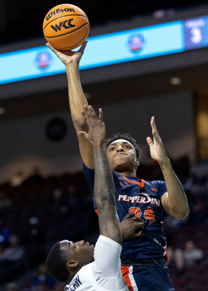 Pepperdine forward Maxwell Lewis (24), who is from Las Vegas, shoots against Pacific’s G ...