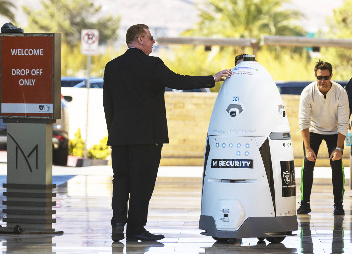Kevin Mounts, left, director of security at M Resort, talks about an autonomous, human-sized ro ...