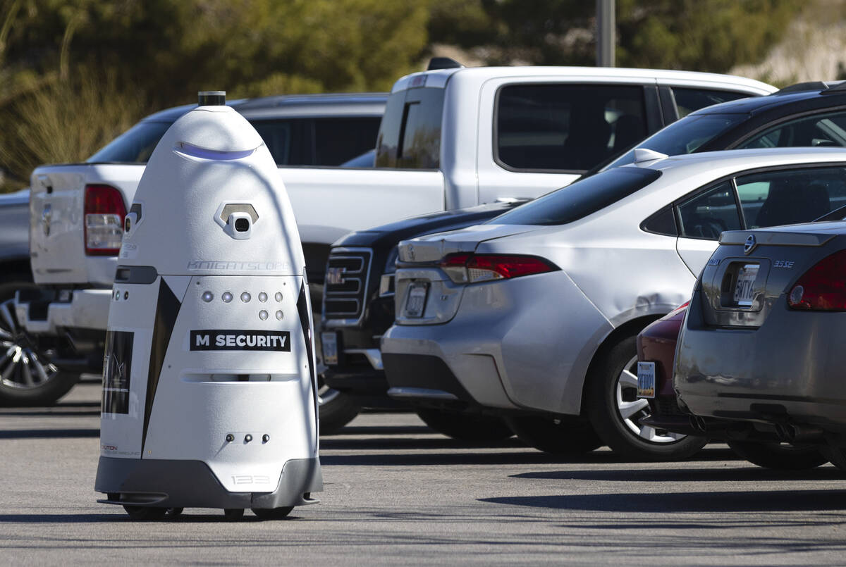 An autonomous, human-sized robot, M Bot, patrols M Resort's surface lots as it scans license pl ...