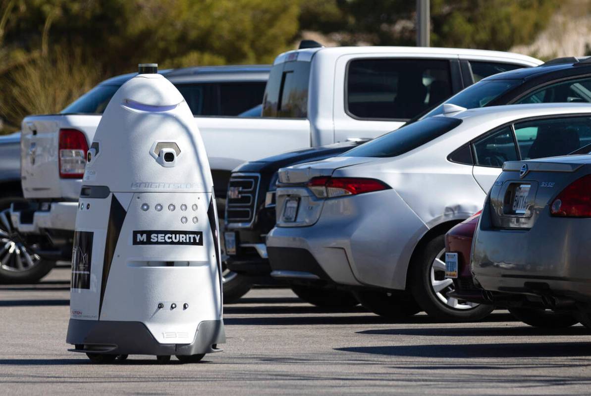 An autonomous, human-sized robot, M Bot, patrols M Resort's surface lots as it scans license pl ...