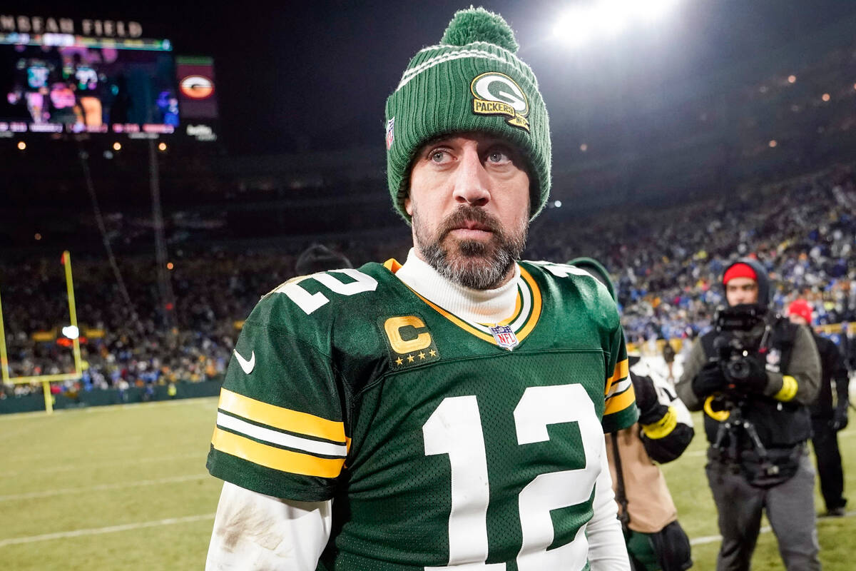 Green Bay Packers' Aaron Rodgers walks off the field after an NFL football game against the Det ...