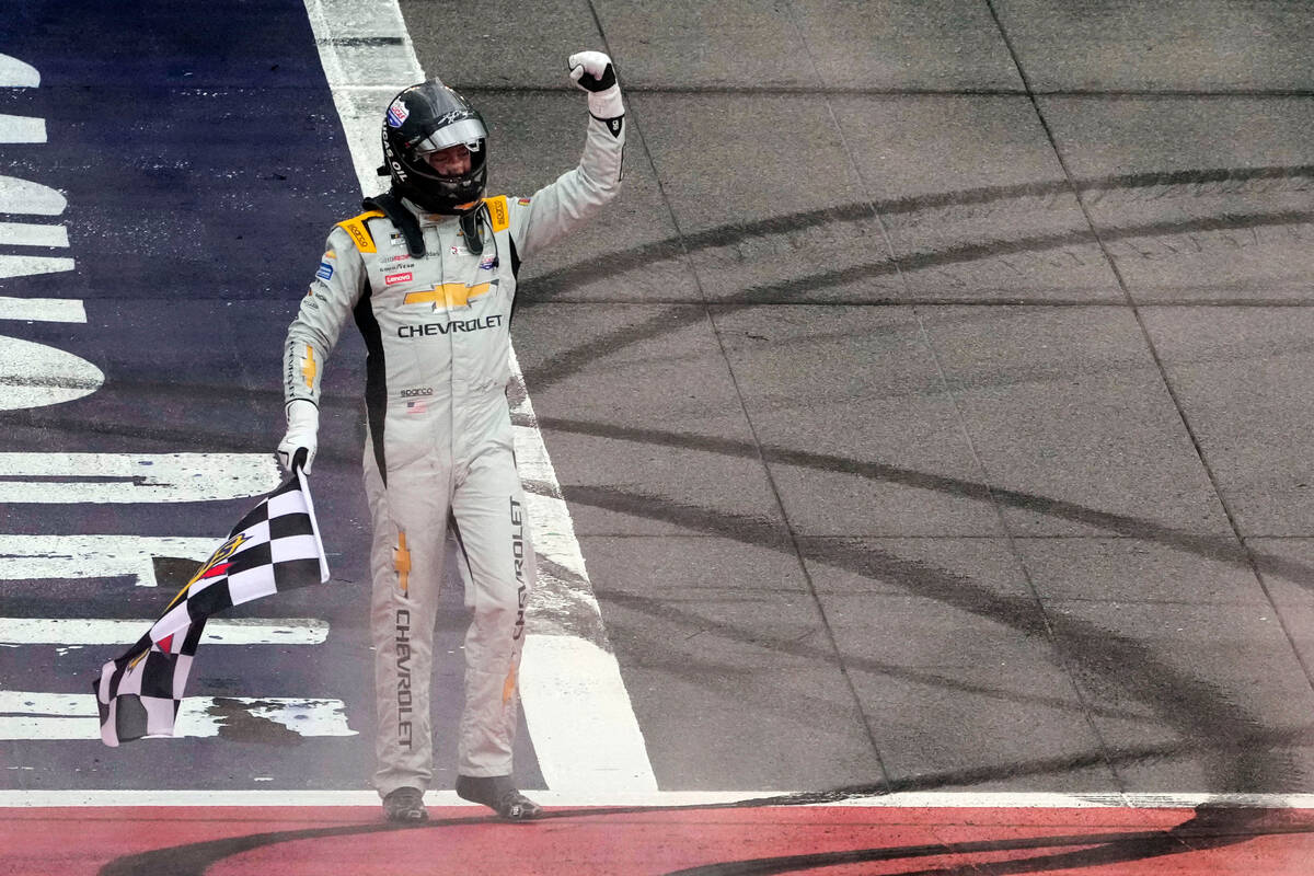 Kyle Busch celebrates after winning a NASCAR Cup Series auto race at Auto Club Speedway in Font ...