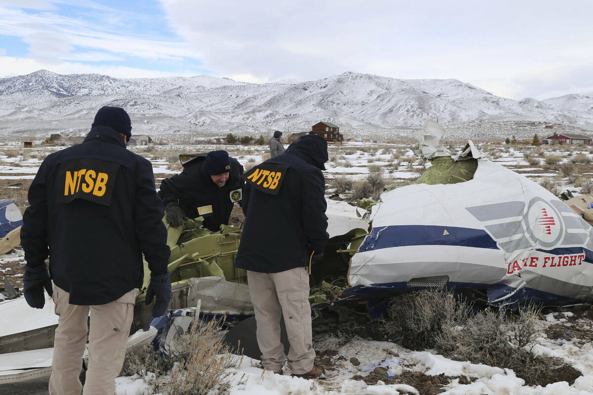 This photo provided by The National Transportation Safety Board shows NTSB investigators on Sun ...