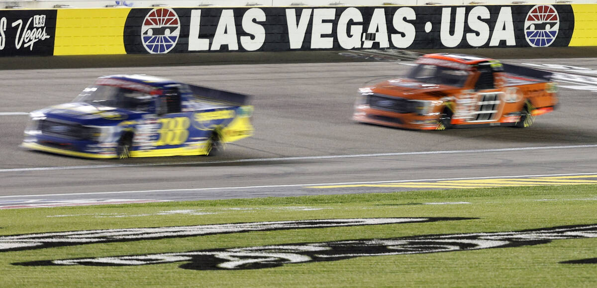 Zane Smith (38) and Ben Rhodes (99) compete during the NASCAR Craftsman Truck Series auto race ...