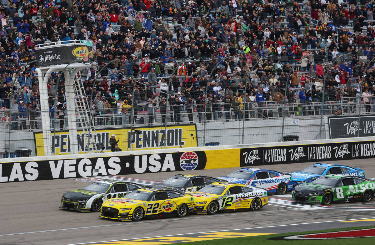 The green flag is waved to signal the start of the Pennzoil 400 NASCAR Cup Series race at Las V ...