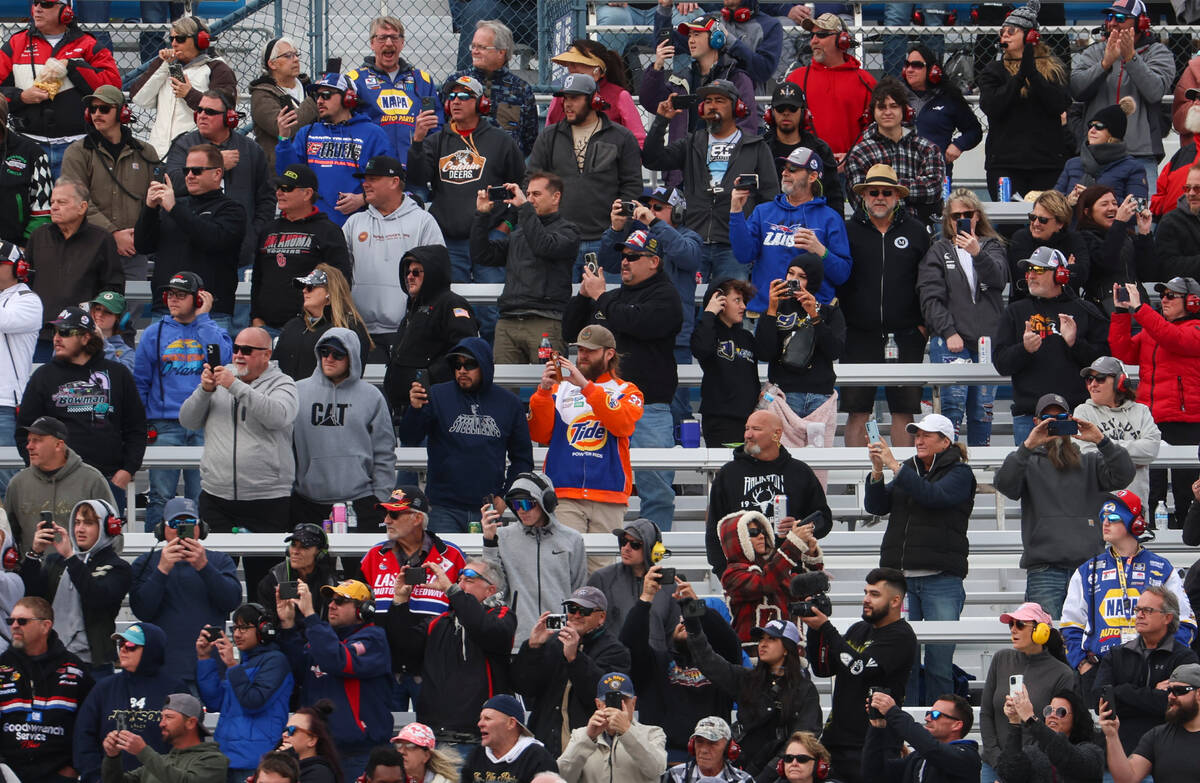 Fans look on as the Pennzoil 400 NASCAR Cup Series race begins at Las Vegas Motor Speedway on S ...